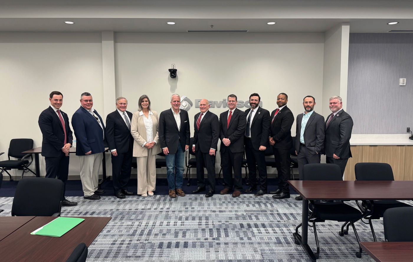 (L-R: Jay McCreary, Director, Space & Defense Services; Dana Mock, ISSM, Davidson FGA Site Lead; Rod Steakley, Davidson Board Member; Michele Wilson, GMD Program Manager, VP; Sen. Dan Sullivan (R-AK); MG John Holly (USA, Ret.) Davidson Board Chairman; James Lackey, Chief Operating Officer; Walter Hough, VP of Algorithmic Warfare; James Gatewood, VP of Enterprise IT & Cybersecurity; Jameson Venema, Technical Director; Seth Bush, CISSP, Director, Information Assurance/Security Ops)