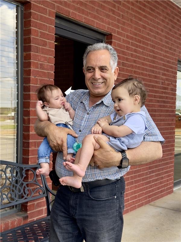 Saeed Adibi with his grandchildren
